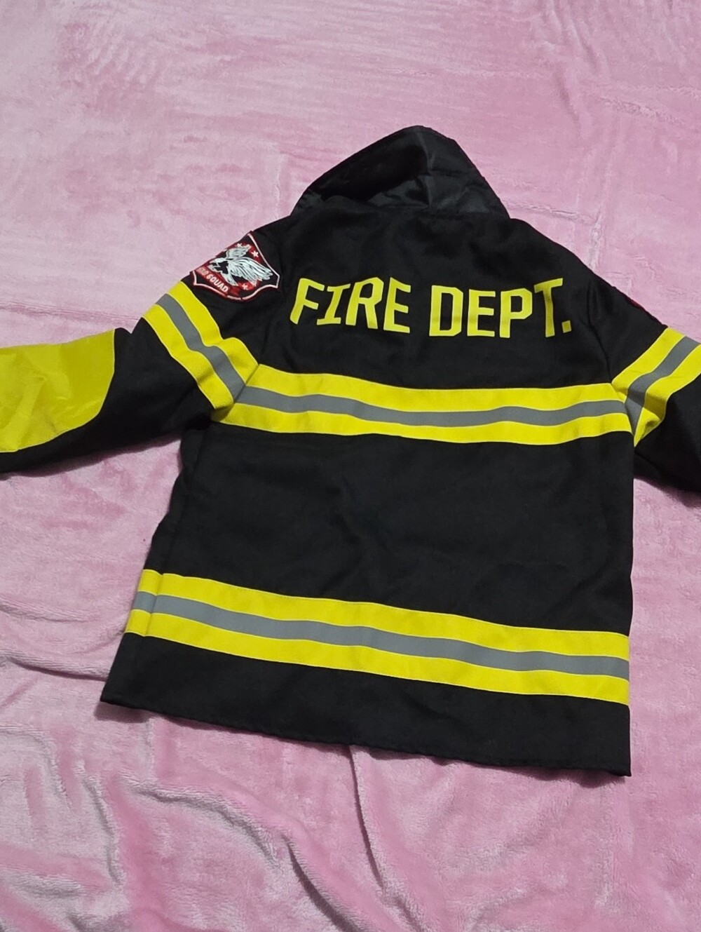 Disguise label with multicolor logo on black fabric